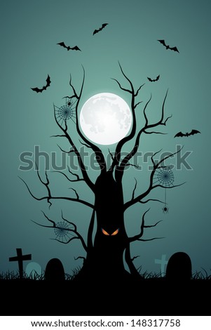 Halloween background with ominous tree in the cemetery
