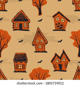 Halloween background. Seamless autumn pattern. Spooky village. Orange silhouettes of houses, trees and bats on yellow background. Vector illustration