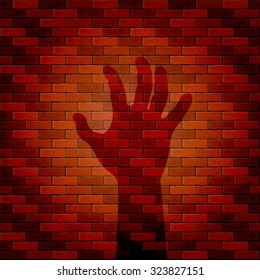Halloween background with shadow of hand on a brick wall, illustration.