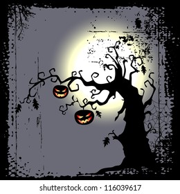 Halloween background - two pumpkins are hanging on the tree