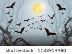 Halloween background.Spooky forest with full moon and bats flying