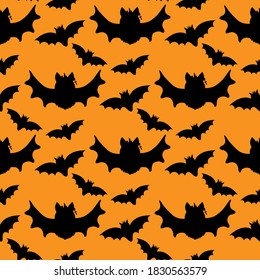 Halloween bat seamless pattern, black bat silhouette on orange background, vector.