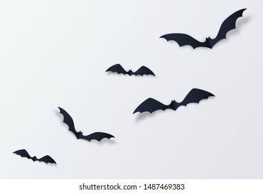 Halloween bat vector decor background. Paper cut style. Black vampire flittermouse flying over white backdrop.