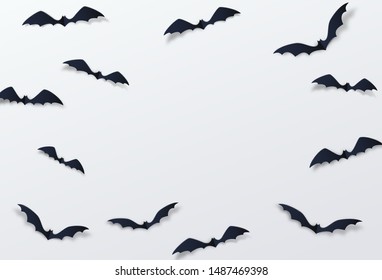 Halloween bat vector decor background. Paper cut style. Black vampire flittermouse flying over white backdrop. Copy space at the centre.