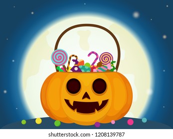 Halloween candies in pumpkin basket