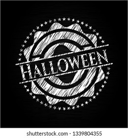 Halloween chalk emblem written on a blackboard