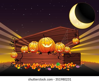 Halloween Coffin of Goodies-Stash of trick or treat candies against midnight sky