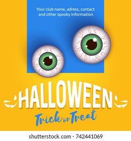 Halloween concept with eyes on yellow wall.
