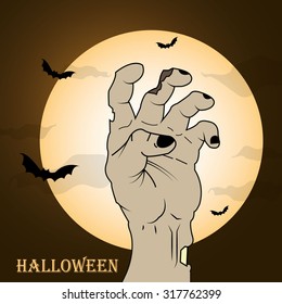 Halloween concept, zombie hand rising out from the ground