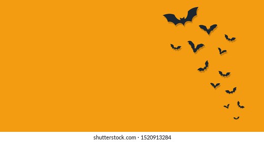 halloween and decoration concept - flat bats flying over orange background - Image