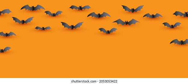 Halloween decoration of flying bat paper style on orange background