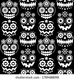 Halloween and Dia de los Muertos skulls and pumpkin faces vector seamless pattern - Mexican sugar skull style monochrome texile design. Day of the Dead scary faces with flowers and geometric shapes 