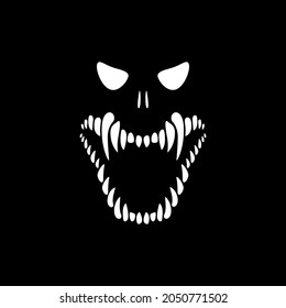 Halloween. The face of the monster on a black background. Skeleton with sharp teeth