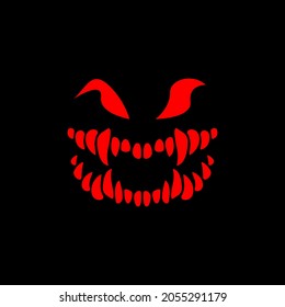 Halloween. The face of the monster on a black background. Skeleton with sharp teeth