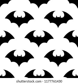 Halloween flying bat.  Vampire vector bat. Dark silhouette of bats flying in a flat style. Seamless pattern. Halloween background.