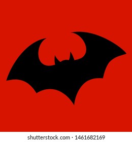 Halloween flying bat.  Vampire vector bat. Dark silhouette of bat flying in a flat style