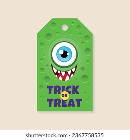 Halloween gift tag template. Funny card with a cartoon smiling monster on a green background. Vector 10 EPS.