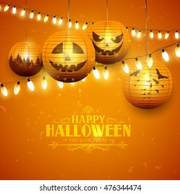 Halloween greeting card with paper lanterns and lights on orange background