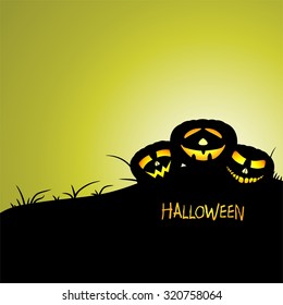 Halloween greeting with three illuminating pumpkins on a hill with grass with the inscription Halloween with green background