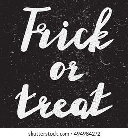 Halloween grunge modern typographic - Trick or Treat. brush calligraphy and hand drawn lettering. Vector isolated. Use halloween cards, covers, tags, icons set and more.