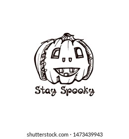 Halloween handdrawn pumpkin with handwritten phrase isolated on white background. Inscription: Stay spooky