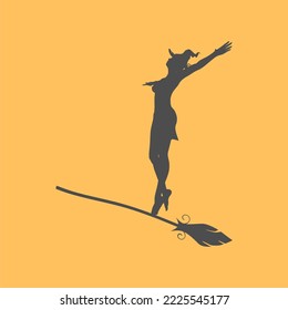 Halloween holiday background. Silhouette of young witch flying on broomstick