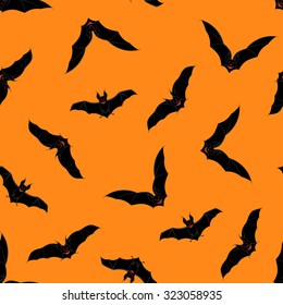 Halloween Holiday Seamless Pattern With Bats Over Orange Background for Creating Halloween Designs.  Vector illustration.