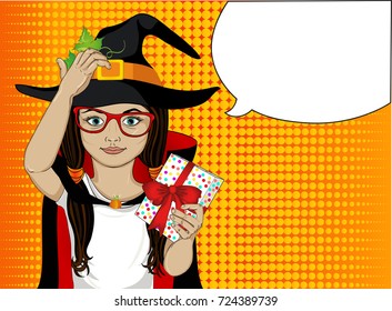 Halloween. A little girl in a hat and a witch costume pensively and holds a present. A child who thinks to give a gift for a holiday. Vector illustration. Pop Art. Thoughts are bubbles.