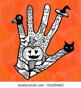 Halloween magic hand. Black and white on leaves background. Backgrounds & textures shop.