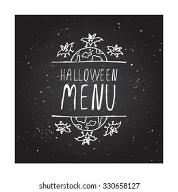 Halloween menu. Hand-sketched typographic element with moon and bats on chalkboard background.  