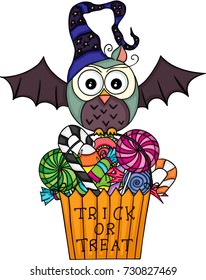 Halloween owl with  trick or treat bag filled with candies
