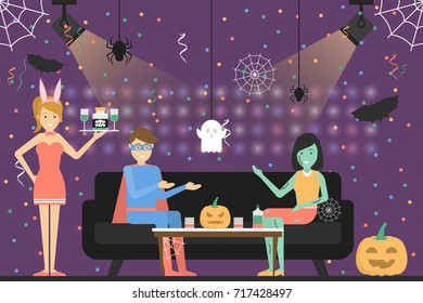 Halloween party at club. People in different costumes having fun.