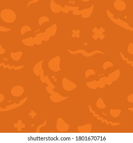 Halloween pattern or pumpkin smiles isolated on orange background. Greeting card or wrapping paper. Halloween background