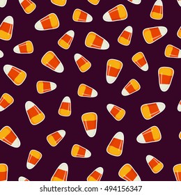 Halloween pattern with small candy corns sweets on dark background. Holiday trick or treat concept. Vector illustration