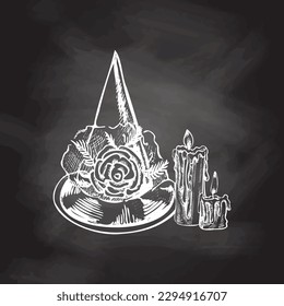 Halloween pointed hat, candles  isolated  on chalkboard  background. Hand drawn vector sketch doodle graphic illustration. Halloween party, holiday, cloth, print, icon, logo, paper, decor.