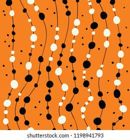 Halloween. Polka dot seamless pattern on black background.