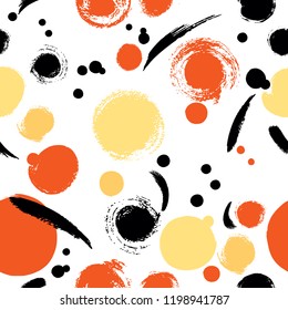Halloween polka dots seamless pattern - black, orange and yellow dots on white
 background.