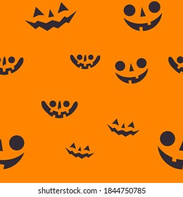 Halloween pumpkin faces seamless pattern. Carved pumpkins texture background.