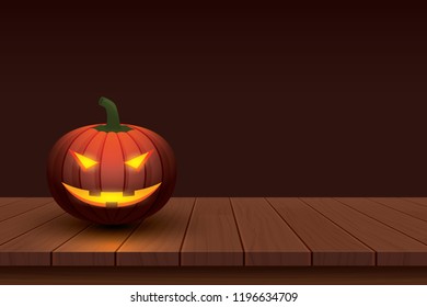 Halloween pumpkin with light glowing in smiling face on wooden table background.