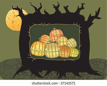 halloween pumpkins lying in the tree hollow
