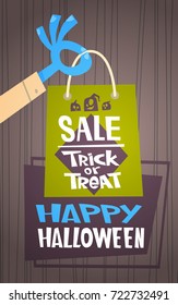 Halloween Sale Holiday Seasonal Discount Concept Monster Hand Holding Shopping Bag Flat Vector Illustration