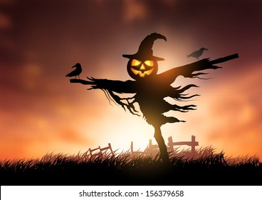 A halloween Scarecrow with a Jack O Lantern head.