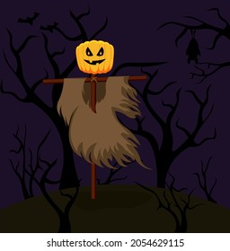 Halloween scarecrow with a pumpkin head stands in the middle of a creepy forest