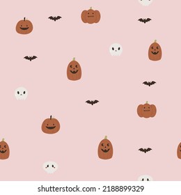 Halloween seamless paper with pumpkins, bats and skulls on pink background. Holiday design for gift boxes, wrapping paper, fabric.