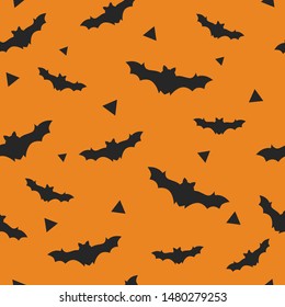 Halloween seamless pattern with bat on an orange background. Halloween background