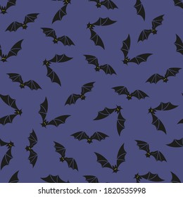 Halloween seamless pattern with bat silhouettes on violet background. Vector Illustration