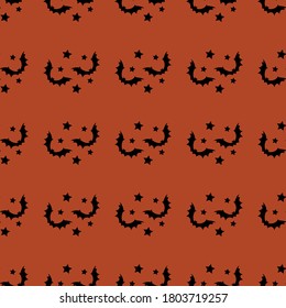 Halloween seamless pattern with black bats and stars on dark orange background