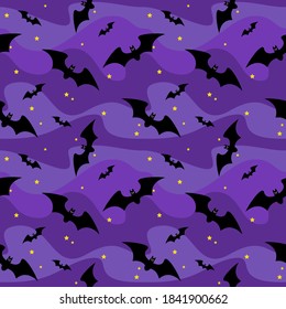 Halloween seamless pattern black bats on a background of blue night sky with yellow stars. Vector illustration