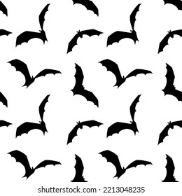 Halloween seamless pattern with black bats silhouettes on a white background. Vector illustration