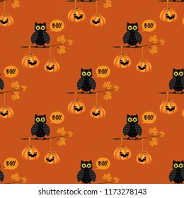 Halloween seamless pattern with black owls on branch and Halloween pumpkin.
